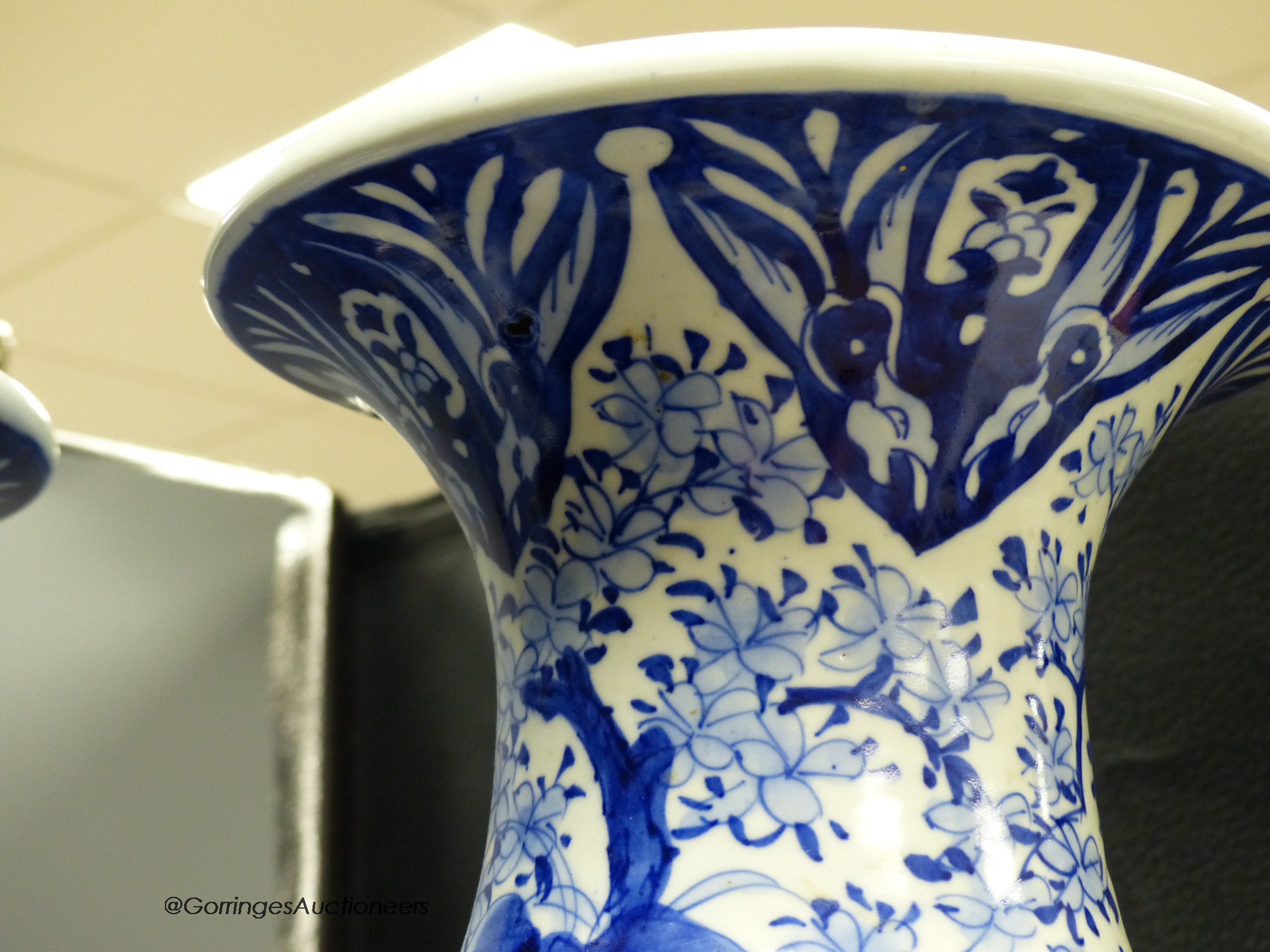 A pair of large Japanese blue and white vases (one a.f.), 60cm high